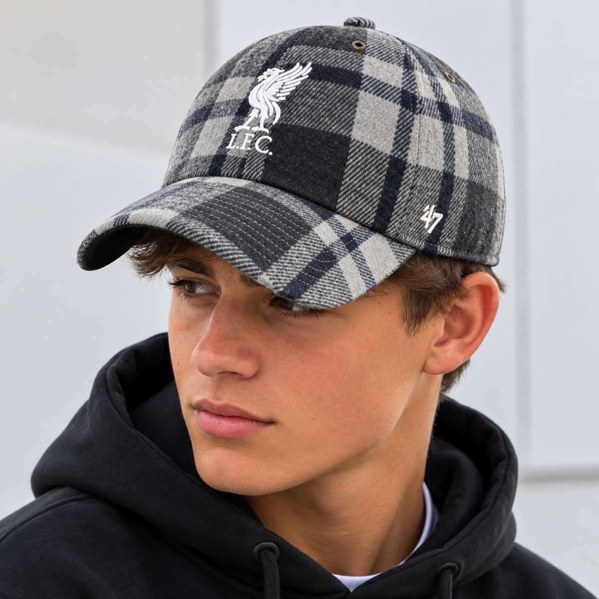 model wearing plaid liverpool fc cap