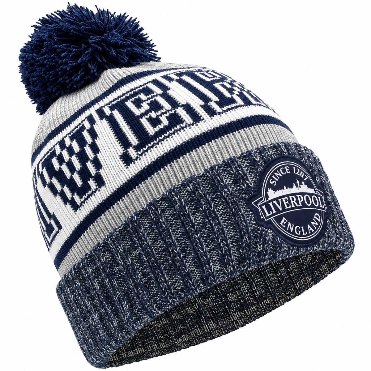 A navy blue and white knit beanie with a large pom-pom on top. The front has a bold navy and white striped pattern with the word 'LIVERPOOL' in large block letters, and a circular embroidered patch on the cuff that reads 'SINCE 1897 LIVERPOOL ENGLAND'.