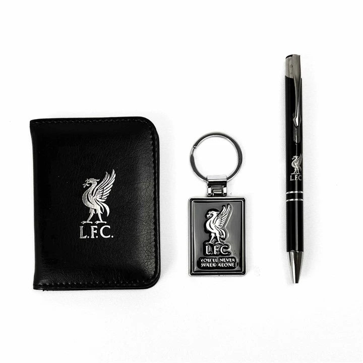 A black leather wallet, a black metal keychain with a silver-toned Liverbird emblem, and a black pen with silver accents, all featuring the Liverpool Football Club logo and text, arranged on a plain white background.
